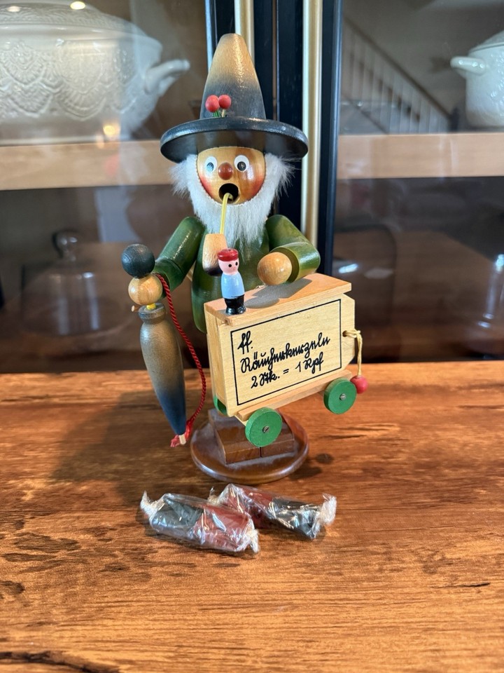 A hand-carved Steinbock German incense smoker figure — the kind of old-world craftsmanship that makes a shelf look like a Bavarian Christmas market.