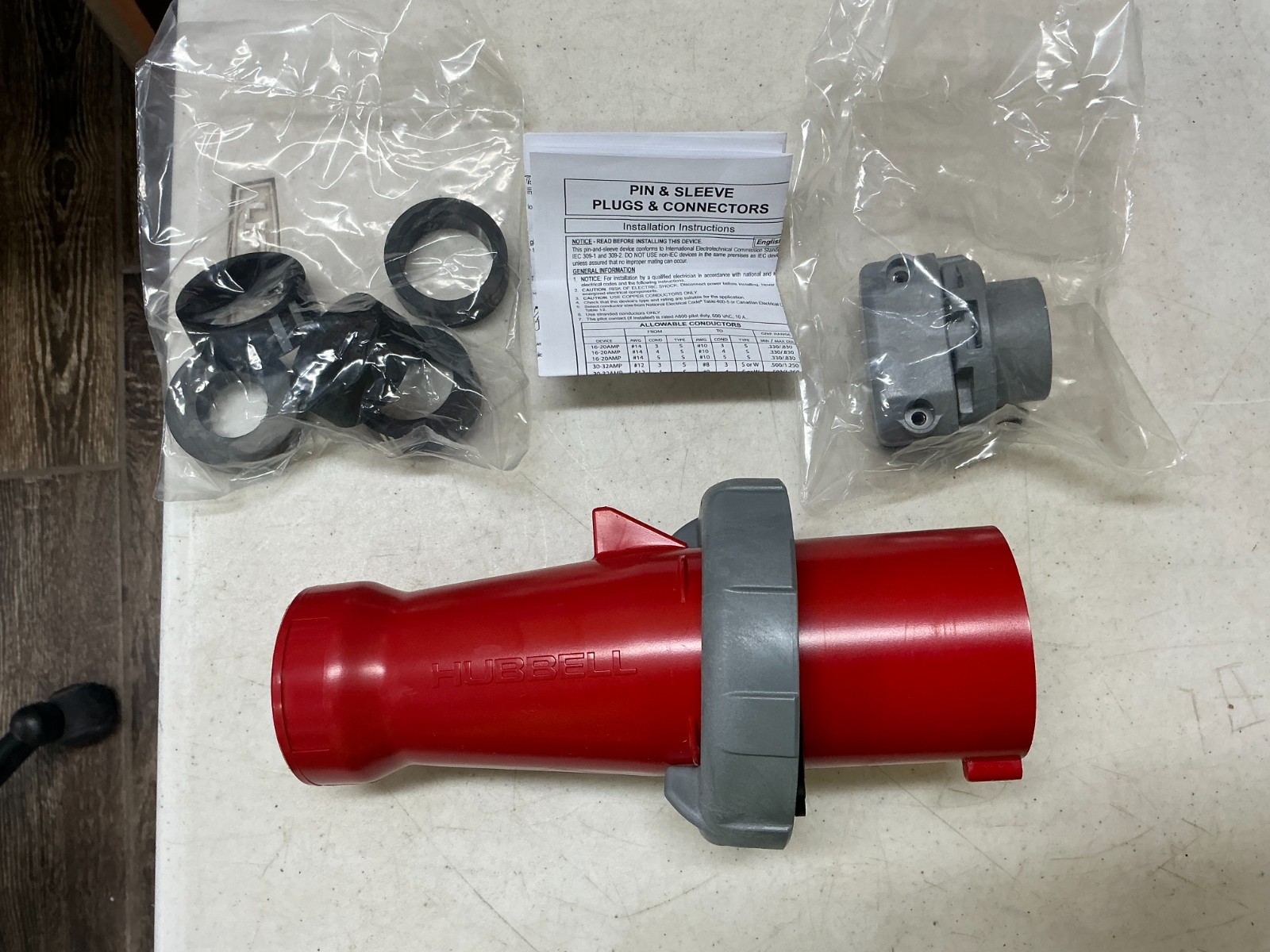 NEW - Hubbell HBL460P7W 60A 480V 3P 4W Pin Sleeve Plug Watertight Red Industrial