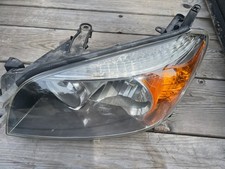 2010 Toyota Rav4 left headlight used