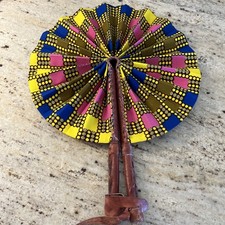 Colorful Handmade West African Ankara fabric folding fan with leather handle.