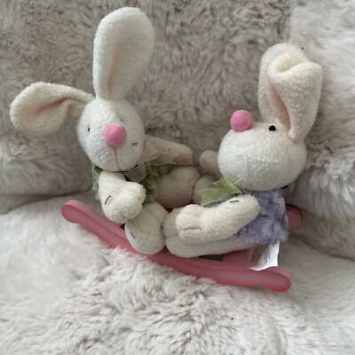 two rabbits on a swing toy Easter bunnies
