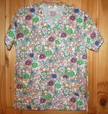 Expo SCRUB TOP size XS  Tan w/ Beautiful Colorful Flowers everywhere