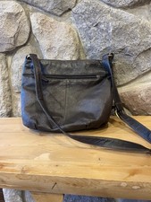 brown shoulder bag tassel accent zipper inner pockets gold hardware