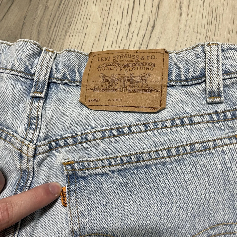Pantalones cortos vaqueros vintage años 90 Levis 950 naranja lengüeta para mujer talla 13 calce relajado Foto 2 de 4