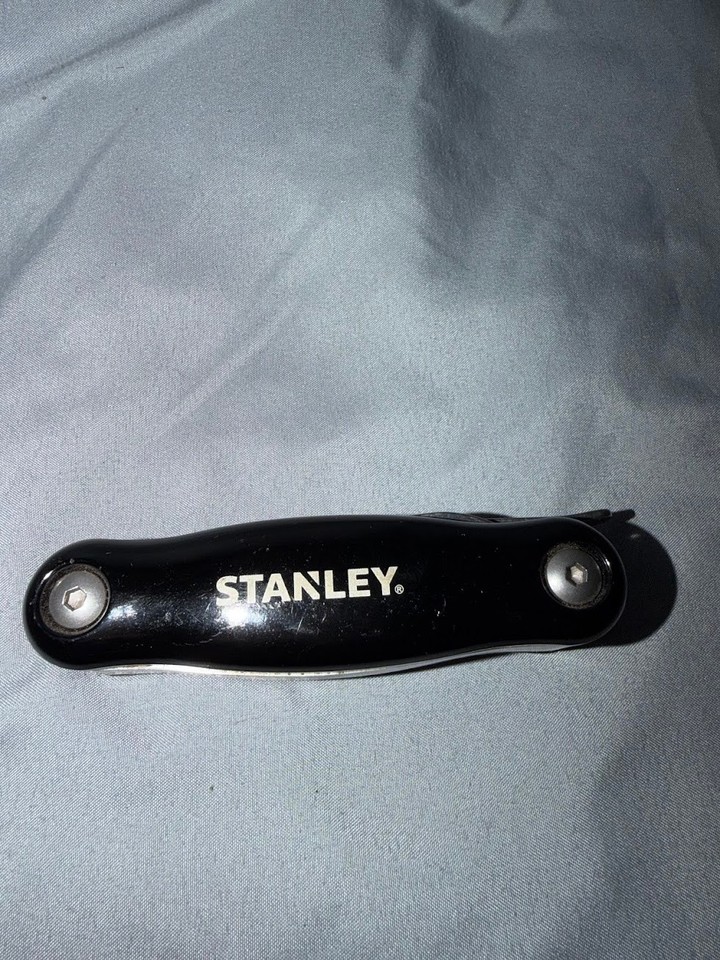 A vintage Stanley multi-tool packing pliers, saw, file, AND knife into one compact unit — classic American multi-tool before Leatherman made it cool.
