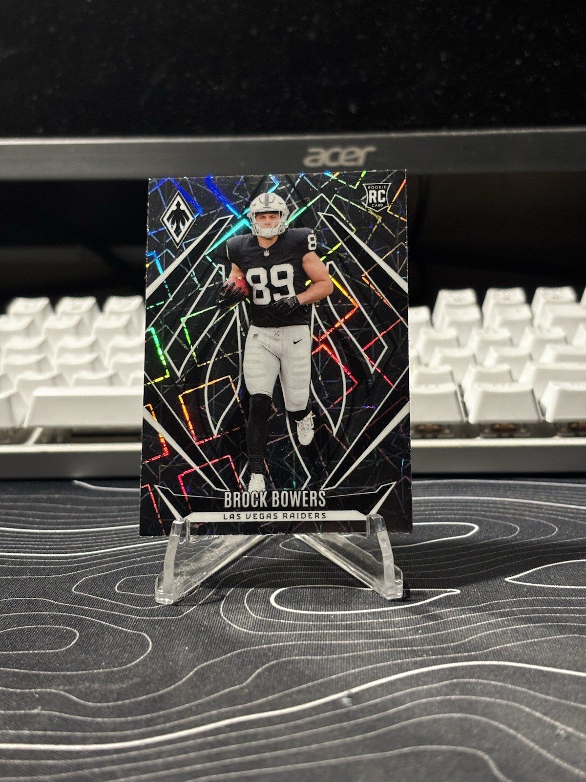 2024 Panini Phoenix - Rookies Brock Bowers #165 Lazer (RC)