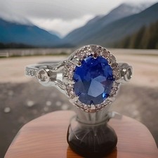 Size T-U; Silver Impressive Carved Woman Ring. Oval Lab Created Blue Sapphire