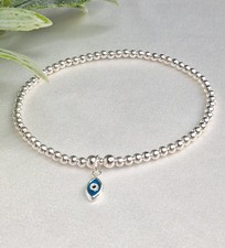 Sterling Silver Bead Elasticated Stretch Bracelet With Mini Evil Eye Charm