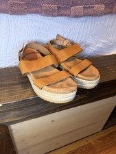Stylish and comfortable women's tan sandals perfect for casual outings.