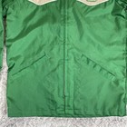 Green and tan Pioneer Seeds Swingster jacket with front zipper, two chest pockets, and “Swingster” logo on chest.