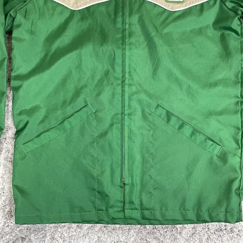 Green and tan Pioneer Seeds Swingster jacket with front zipper, two chest pockets, and “Swingster” logo on chest.