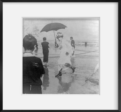 1890 Photo Caught by the tide Well-dressed woman with umbrella walking on beach photo