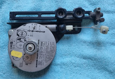 Radial arm return mechanism for cross cut saw.