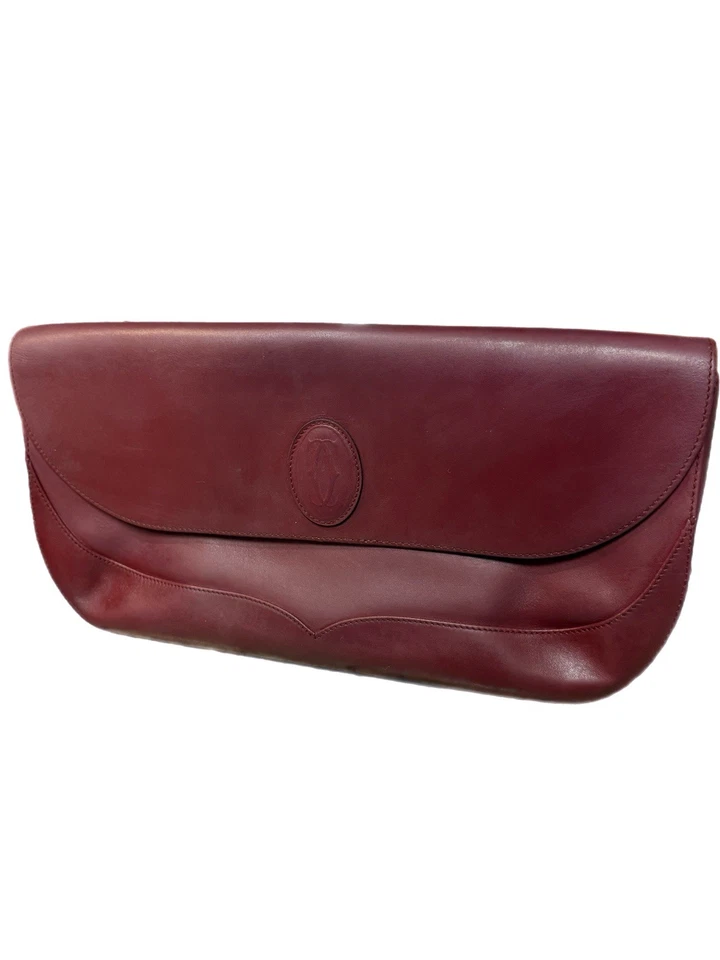 Bolso sin asas Cartier vintage de cuero borgoña con bolsa para el polvo y tarjeta de autenticidad Foto 2 de 4