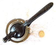 Cast iron lemon squeezer embossed "X-RAY" with glass cup -circa early 1900's