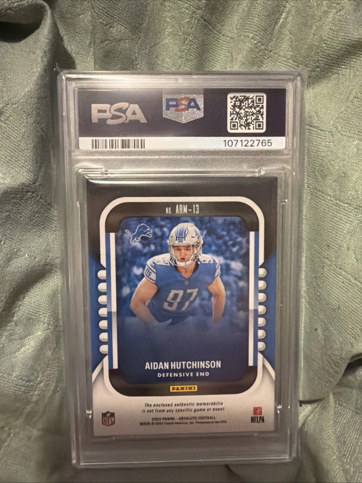 2022 Panini Absolute Rookie Materials Aidan Hutchinson #ARM-13 (MEM, RC) - Image 2 of 2
