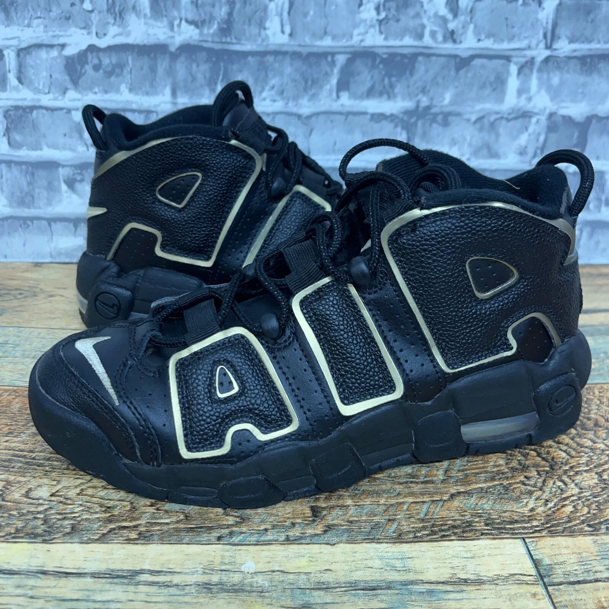 nike uptempo black gold