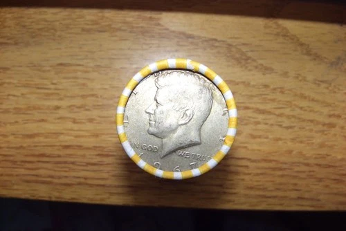 Kennedy half dollar roll with a 40% silver 1969-D  half on end in vV- good cond.