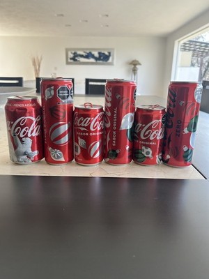 Christmas Coca Cola cans collection diffrent years editions