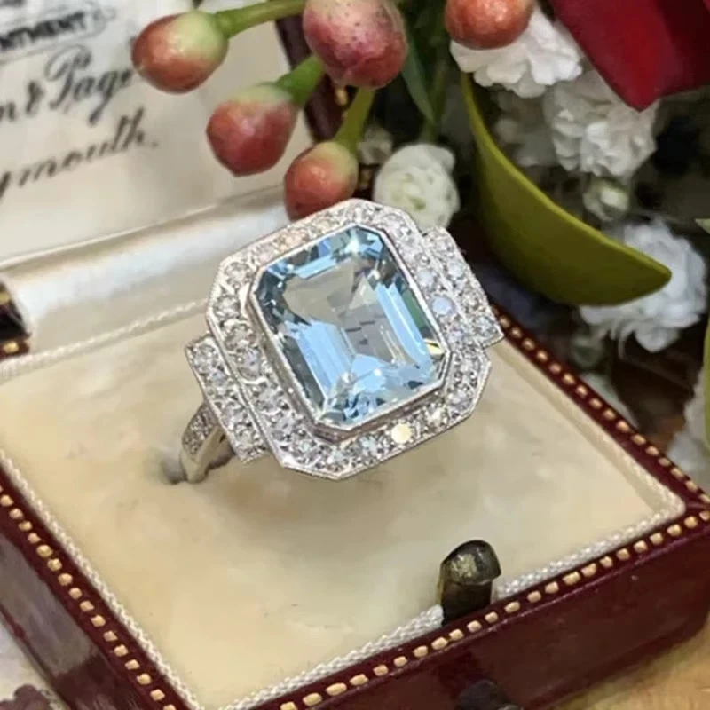 Anillo halo topacio azul creado en laboratorio corte esmeralda 12*10 mm enchapado en oro blanco 14K Foto 2 de 4