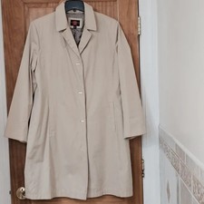 Classic business casual fully lined v-neck long-sleeved snap front closure coat.