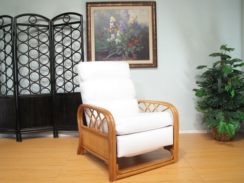 White rattan recliner with padded backrest and armrests, displayed in a light green room with black circular fencing.
