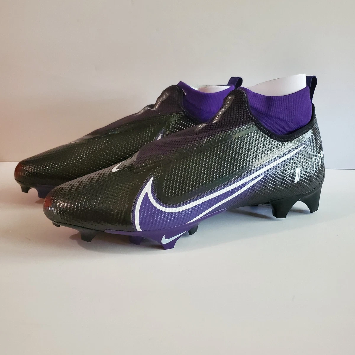 Purple and black best sale cleats