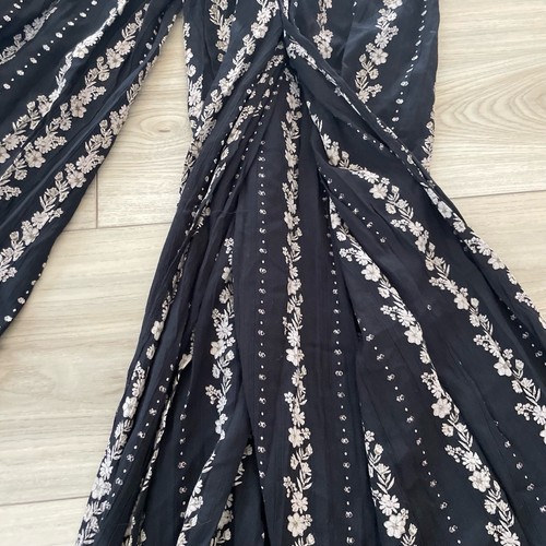 Tuta Boho Angie nera bianca scollo a V gamba spaccata motivo floreale nuova con etichette taglia small - Foto 2 di 5