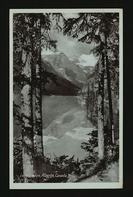 Lake Louise Alberta Canada View through the trees of Lake Louise - Old Photo