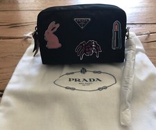 Pochette Prada Nylon in tessuto colore nero con maniglia e applicazioni