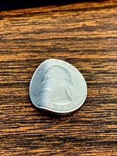 A professionally bent quarter to use in a magic trick / see video 
