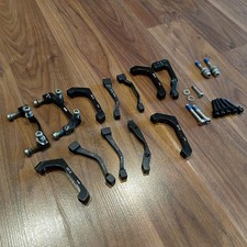 Assorted Bicycle Disc Brake Mounts And Bolts