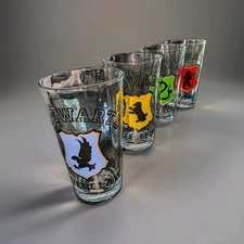 Harry Potter Set of 4 Pint Glasses Hogwarts House Varsity Crests 16 oz