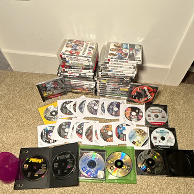 Game lot with 55 PS1, PS2, & PS3 titles including Digimon, Norrath, & Suikoden