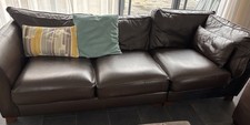 Brown three-seater leather sofa, used, looking for a new home