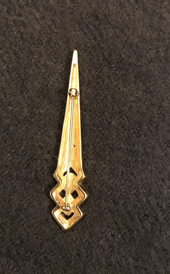 Broche prendedor de diamantes de imitación transparentes en tono dorado y esmalte negro Foto 4 de 4