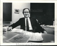 1983 Press Photo Owner of Gendex John J. McDonough seated at Desk in Office