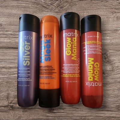 Four 10 oz bottles of Matrix Shampoo and Conditioners