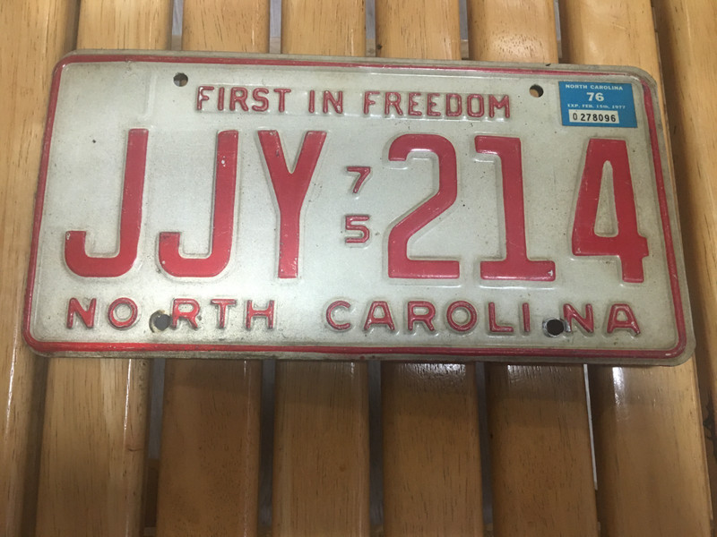 North Carolina NC License Plate 1975 w/ 1976 sticker “First In Freedom” JJY 214