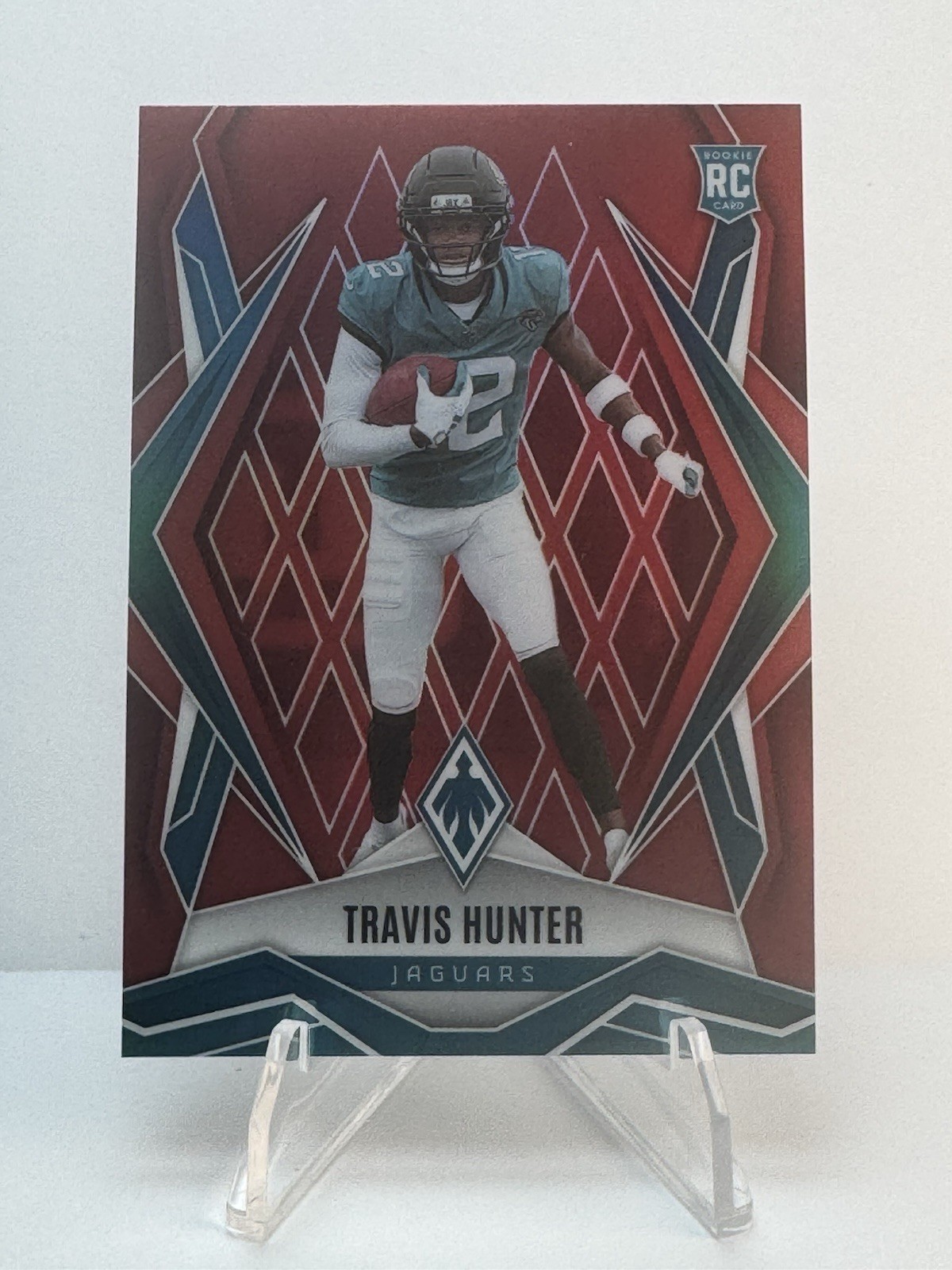 2025 Panini Phoenix - Rookies Travis Hunter #157 Red Seismic 77/99 (RC)