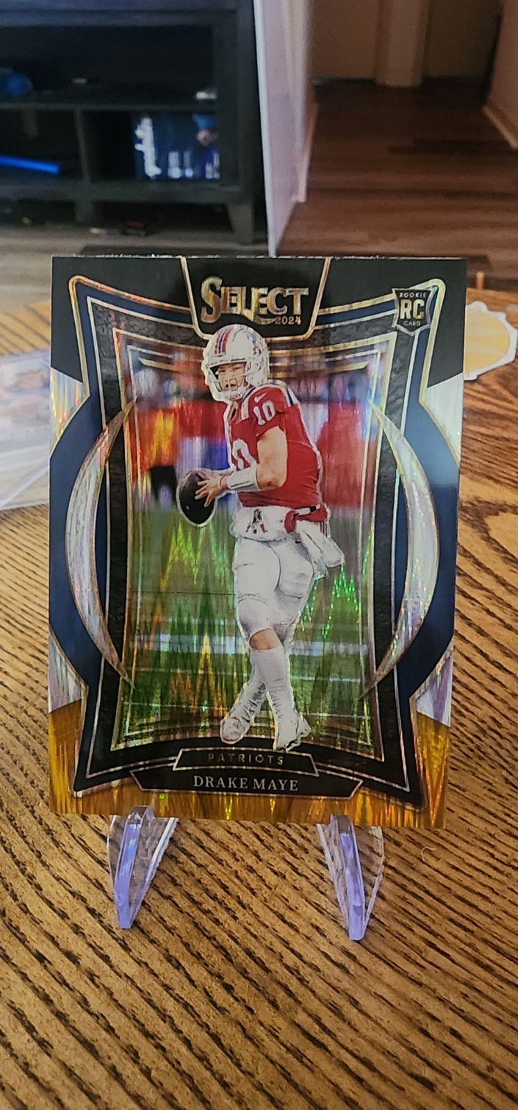 2024 Panini Select - Concourse Drake Maye #27 Black & Orange Shock Prizm (RC)