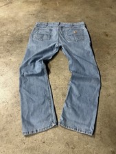 vintage carhartt blue jeans with cool wash to them