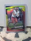 AUSTIN EKELER 2025 PANINI PRIZM FOOTBALL RED YELLOW COMMANDERS /44