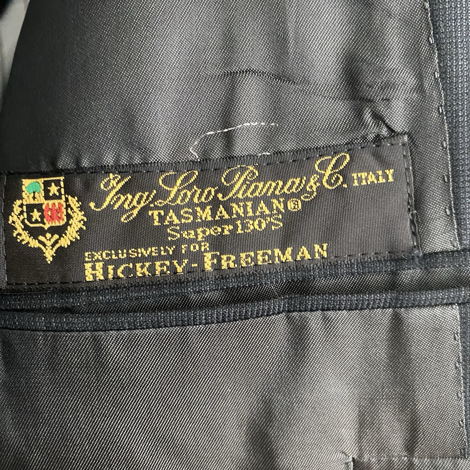 Hickey Freeman men's 100% Super 130’s worsted wool blazer with notch lapel, two-button front, and labeled inner pocket.