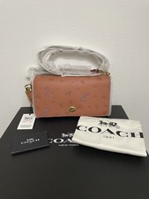 disney x coach dinky with mixed dalmatian print