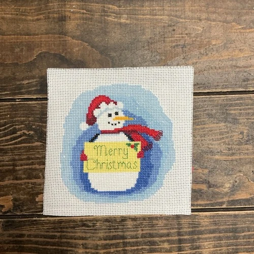 Completed Counted Cross Stitch Of A Snowman Holding A Merry Christmas Sign