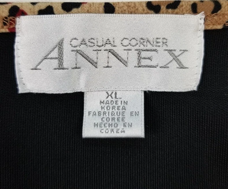 Blusa informal de esquina para mujer extra grande negra con ribete de leopardo cuello redondo manga 3/4 Foto 4 de 4