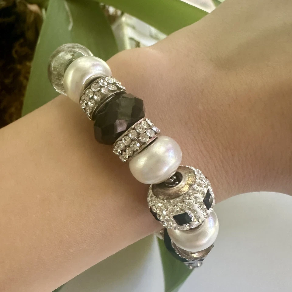 Pulsera Bella Perlina Vintage Tonificada Negra Y Astilla Con Dije Barco Foto 3 de 4