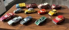 Lot of 13 vintage diecast toy vehicles from various brands.