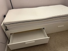 Single bed with a pull out below to combine into a double. Mattress included